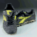 A PAIR OF BLACK AND GREEN DIADORA FOOTBALL BOOTS 